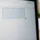 Curseur pointant grille excel avec cellules fusionnees se divisant
